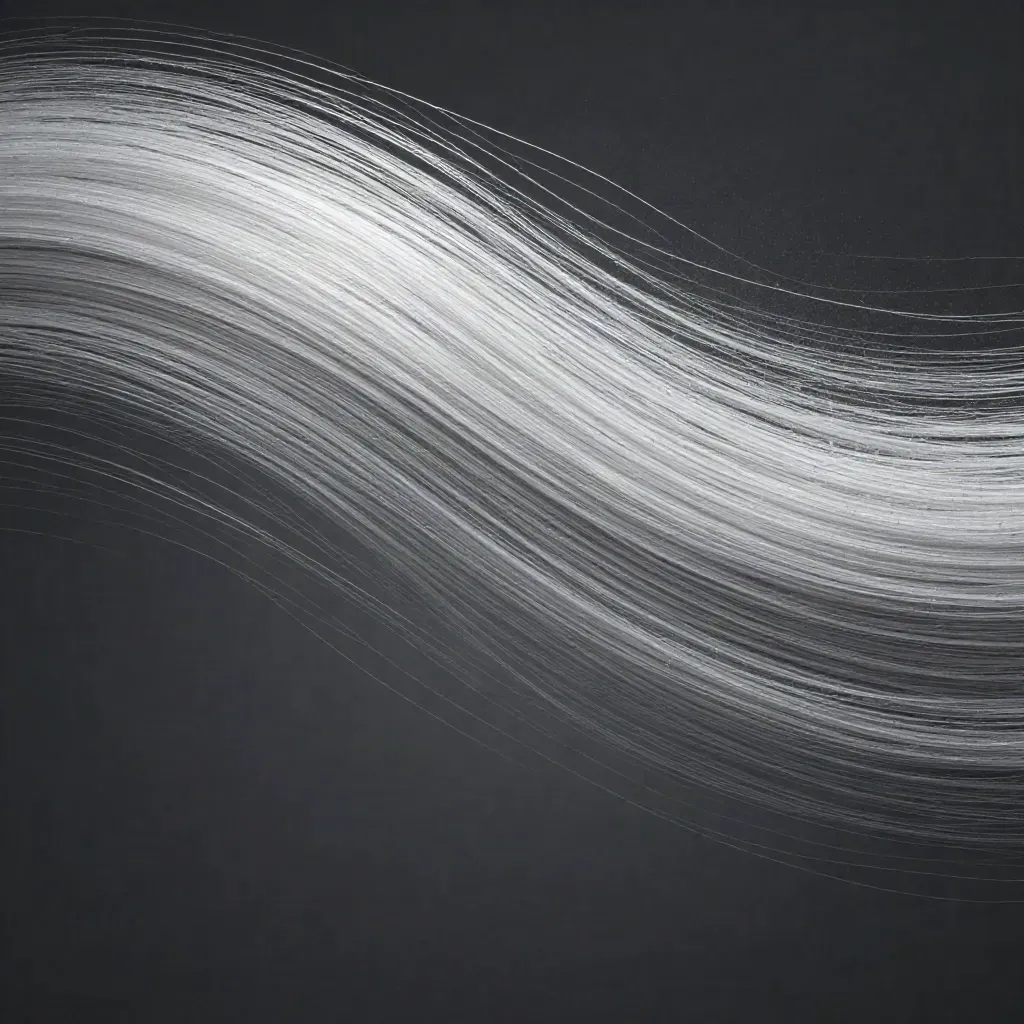 Silver filaments bloom in graphite haze, with calm empty space for copy.